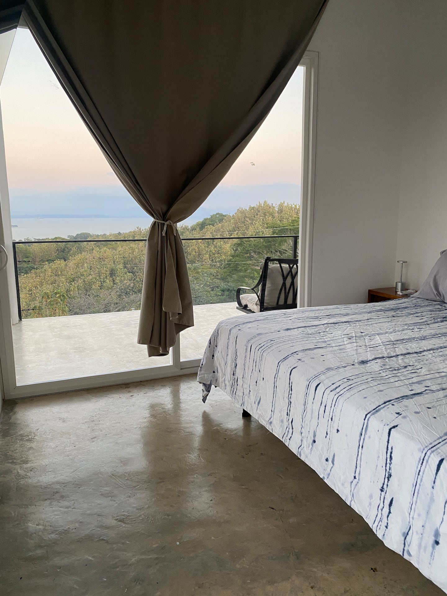 Main bedroom with king bed and private balcony